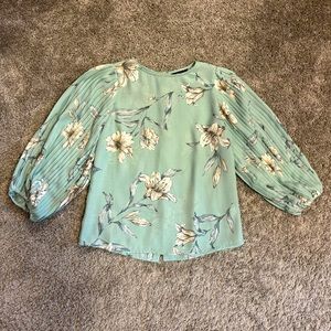 Floral blouse with draped pleated sleeves